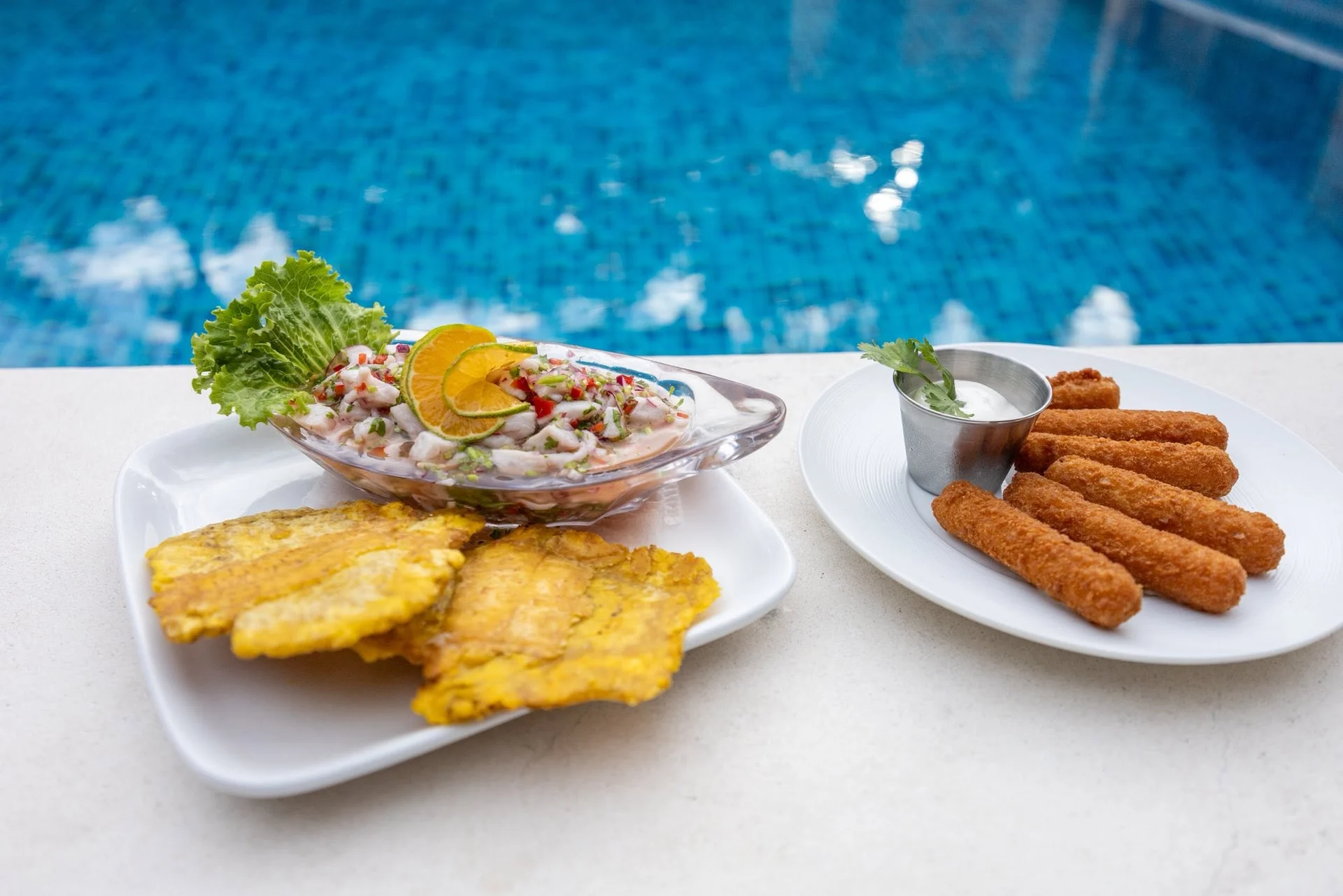 Ceviche, plantains and appetizers beside the pool at El Castillo